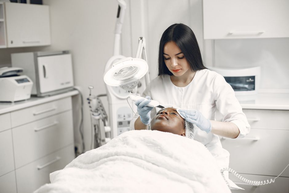 Skin specialist performing a facial skincare treatment