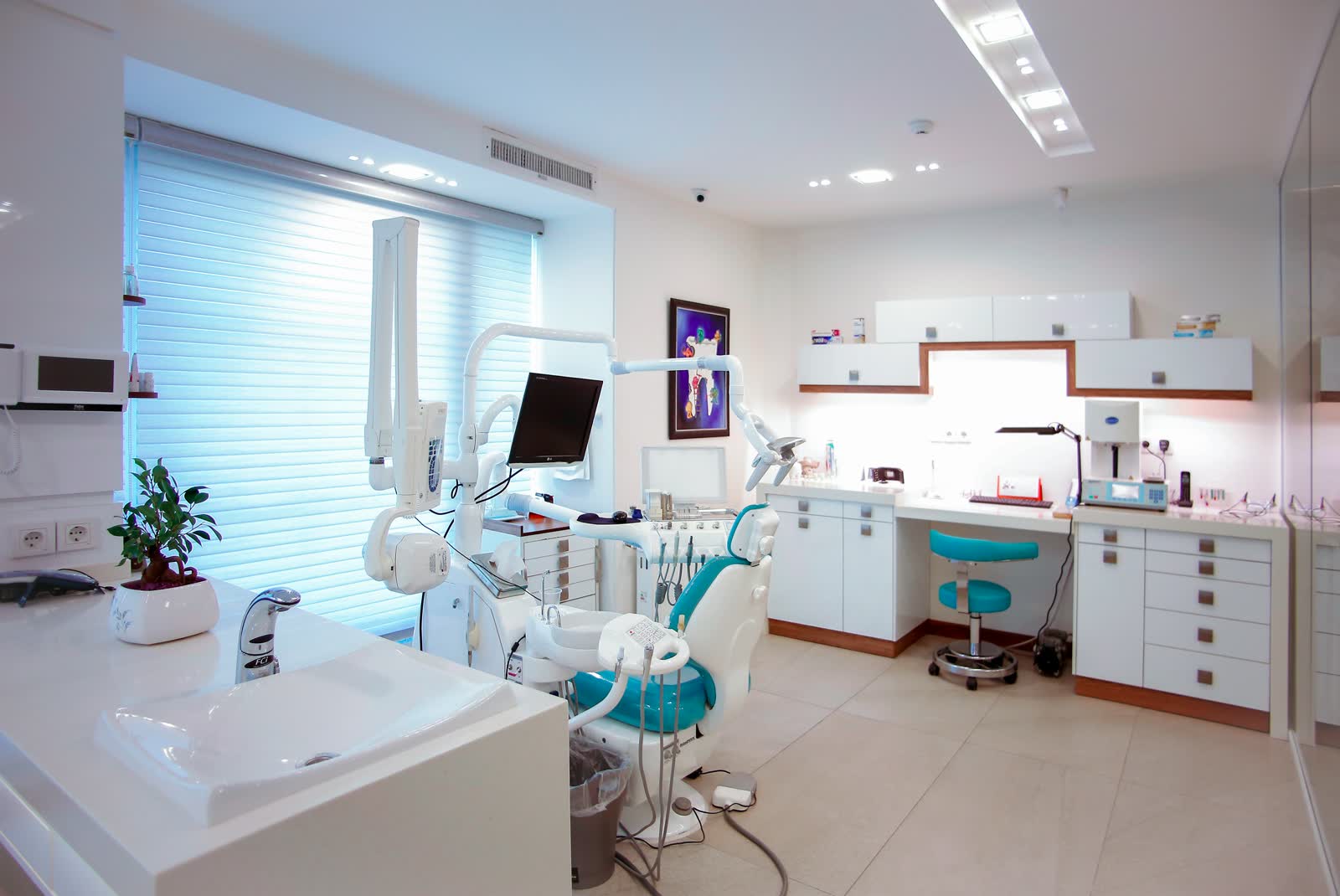 Bright, modern dental treatment room with a patient chair